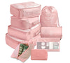 Pink 9 piece set of luggage storage bags for travel.