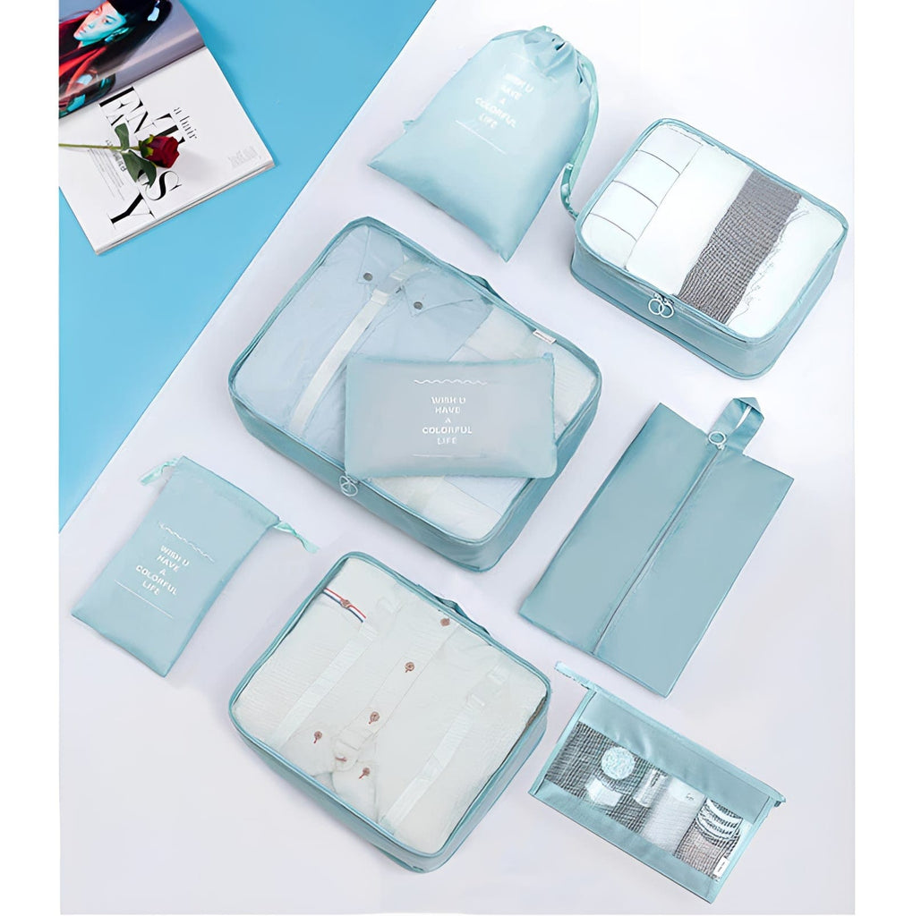 Light blue 9 piece set of luggage storage bags.