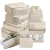 Beige 9 piece set of luggage storage bags.