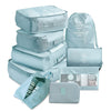 Light blue 9 piece set of luggage storage bags.