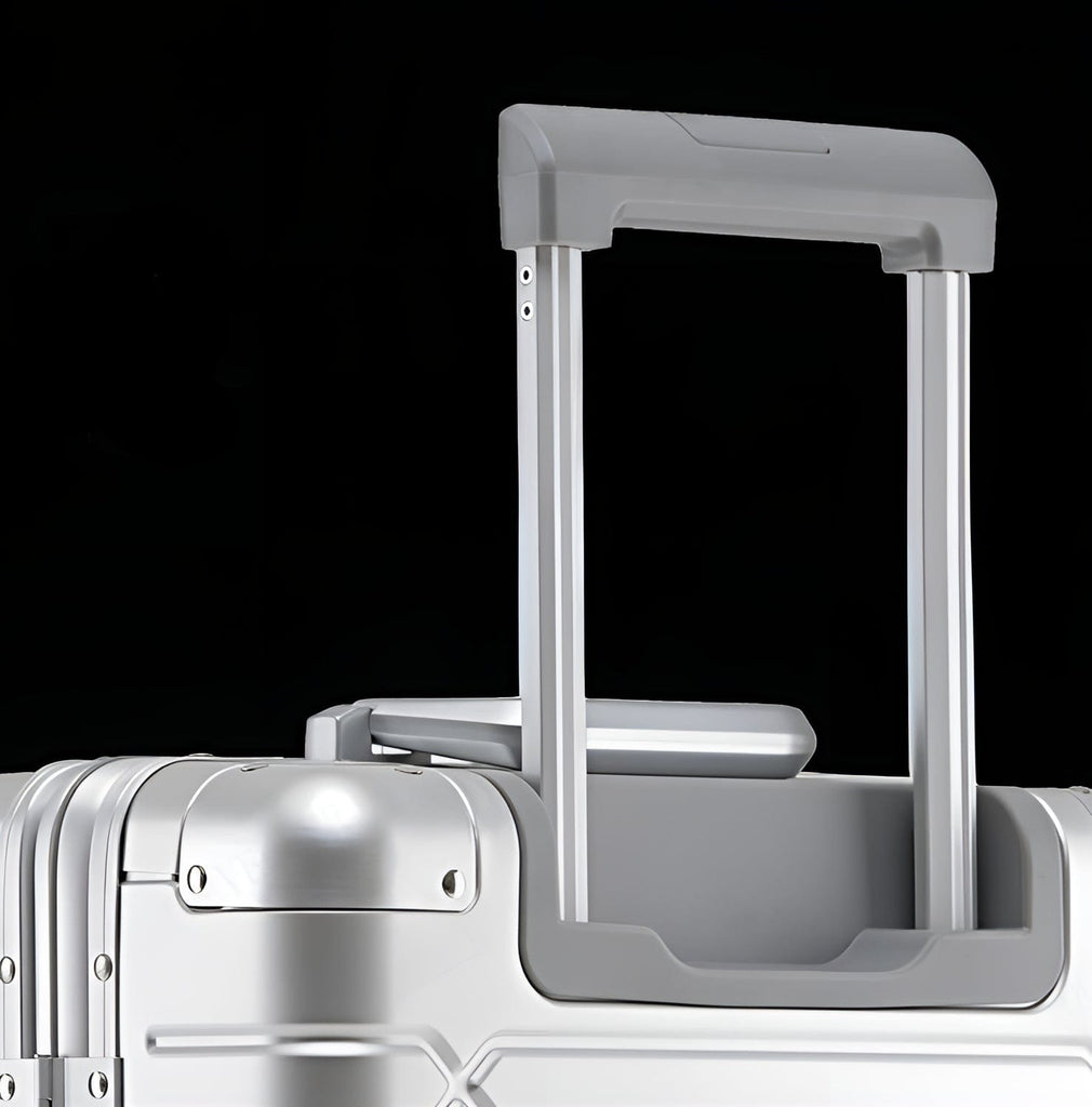 Silver rolling aluminum luggage suitcase.