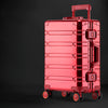 Red rolling aluminum luggage suitcase.