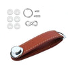 Compact key holder in brown leather with silver metal.