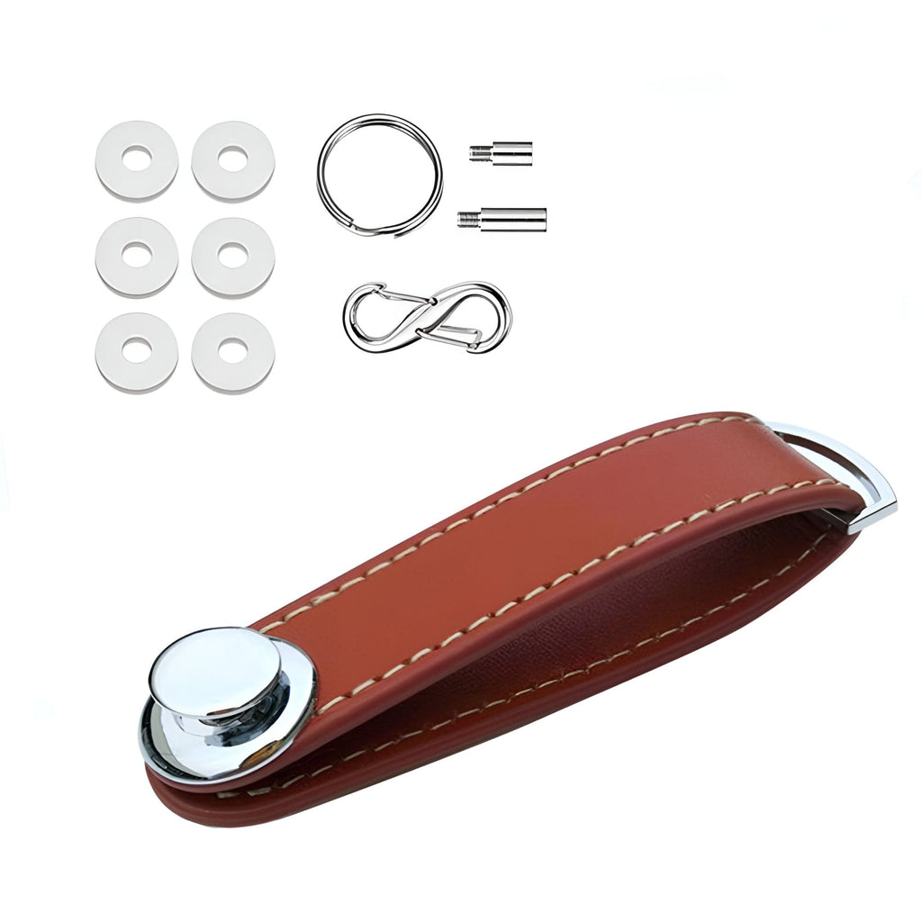 Compact key holder in brown leather with silver metal.