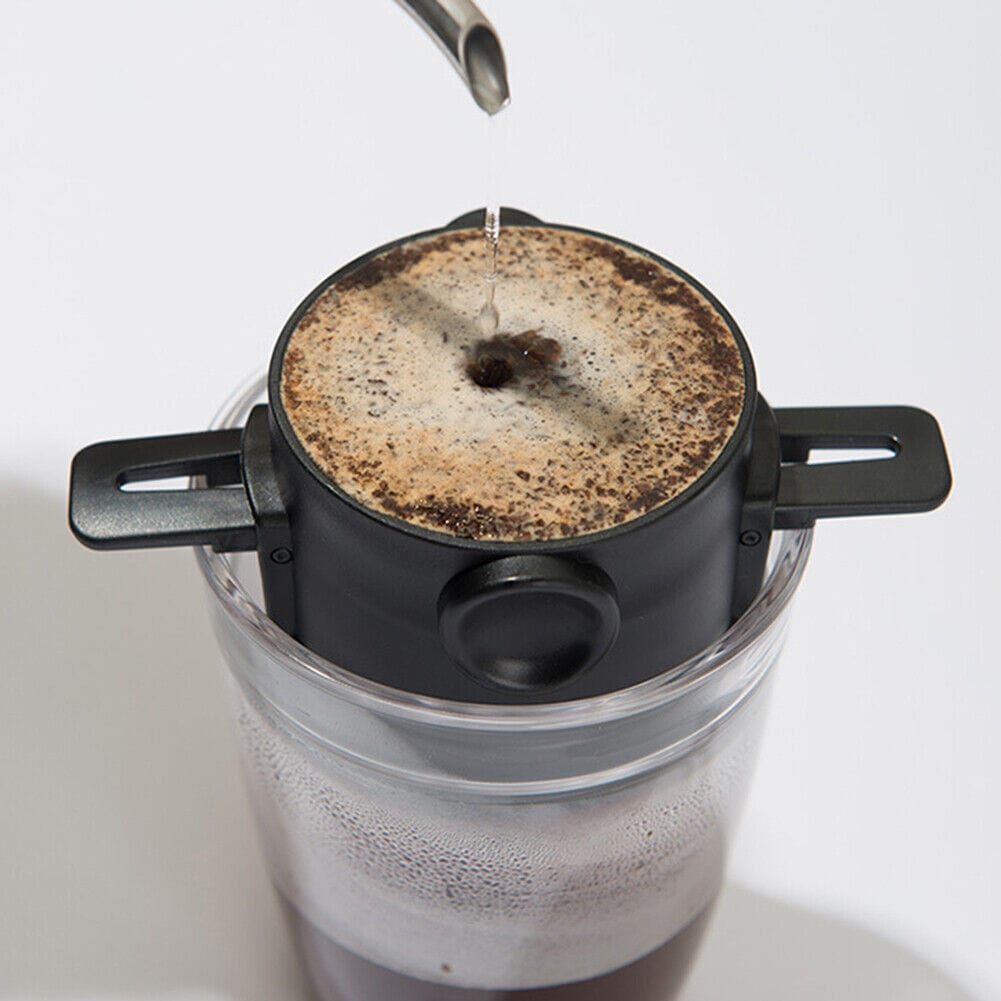 Black Portable Coffee Maker being used on the go.