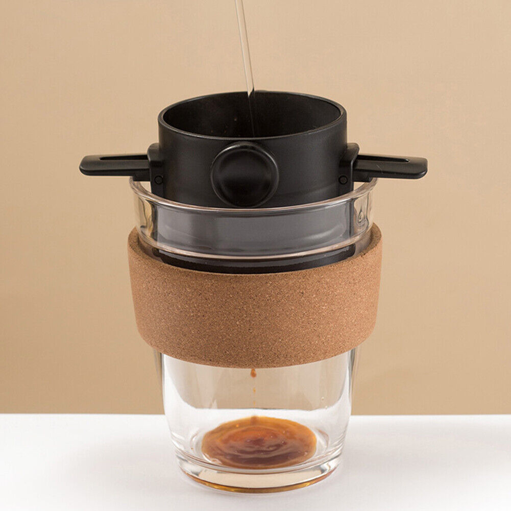 Black Portable Coffee Maker being used on the go.