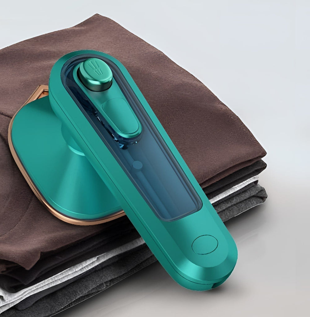 Compact Portable Steam Iron in the color teal.