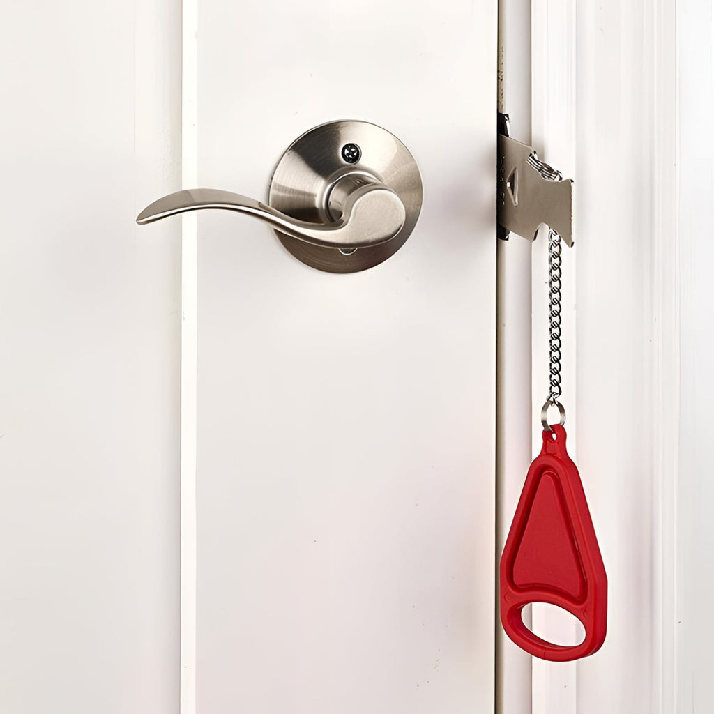 Red Portable Door Lock for travel in a household door.