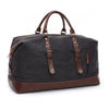 Black faux leather travel duffle bag for travel.